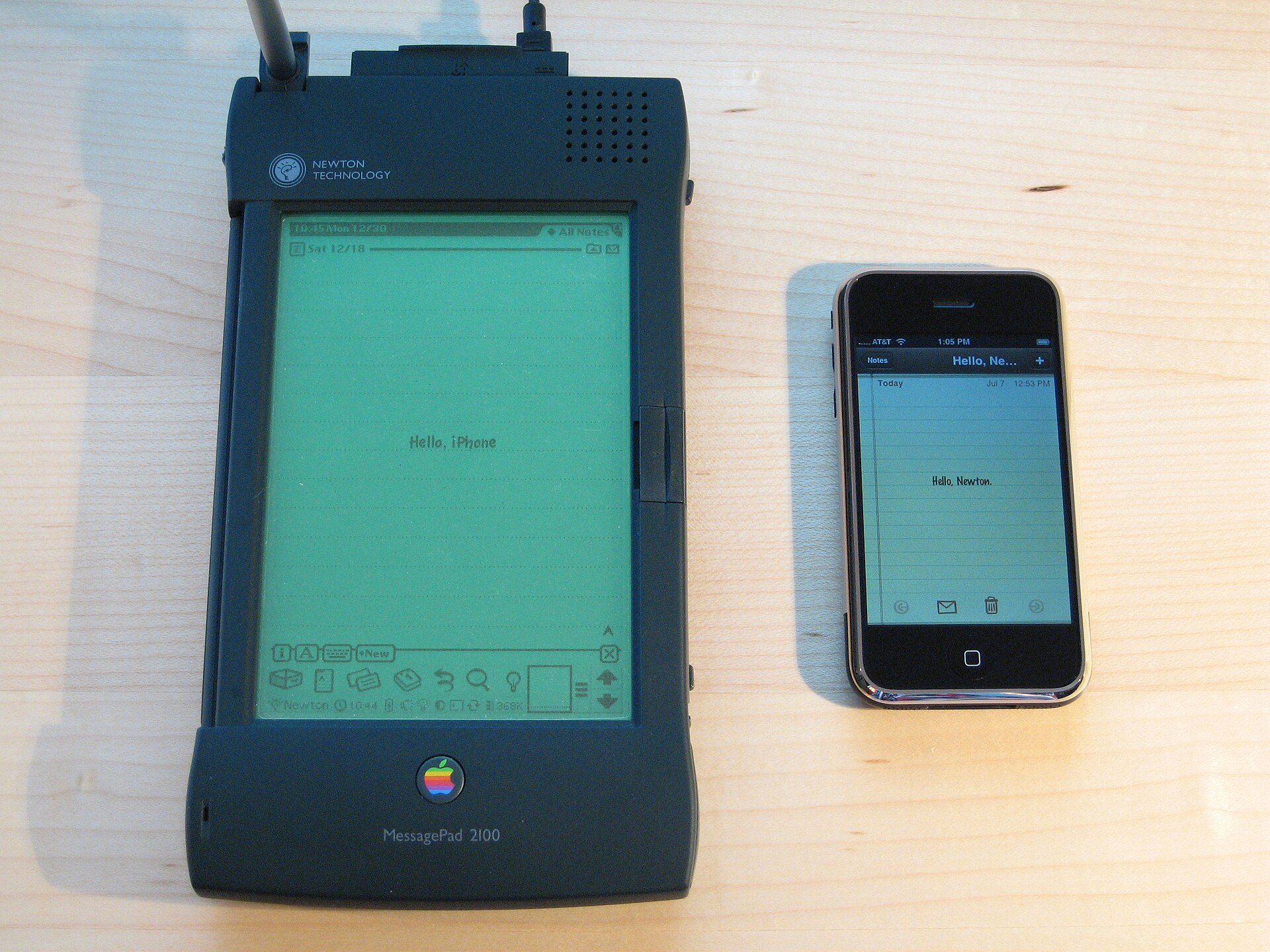 An Apple Newton MessagePad next to an iPhone